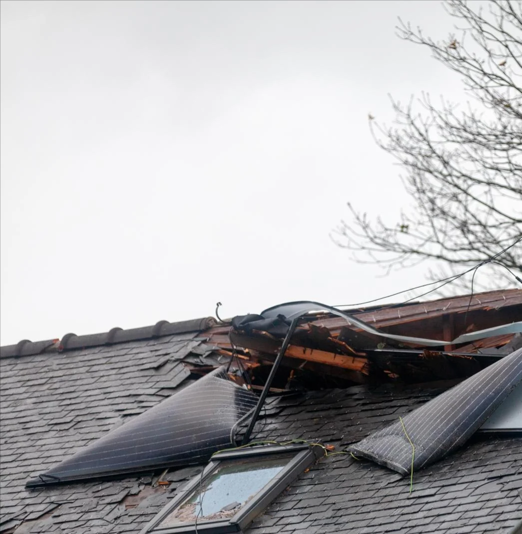 Image of a severely storm-damaged roof